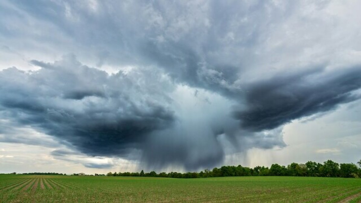 Dramatic clouds over a field 