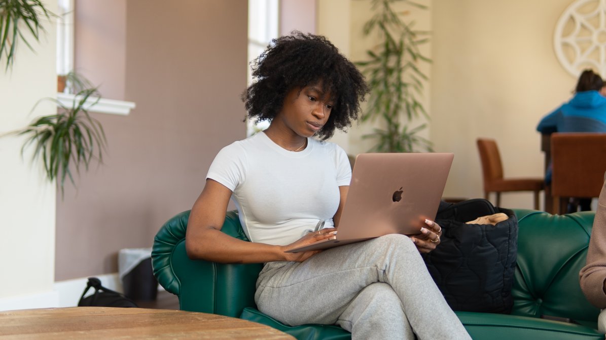 Student sat down with a laptop