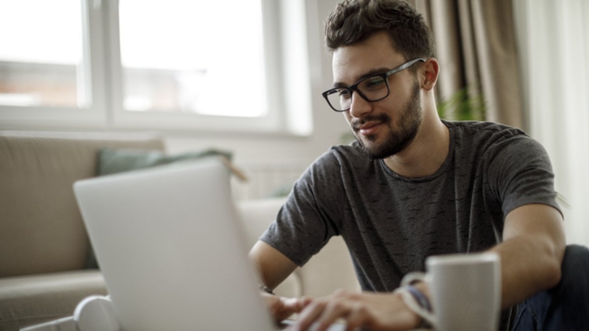 Student-parent using laptop to research online support