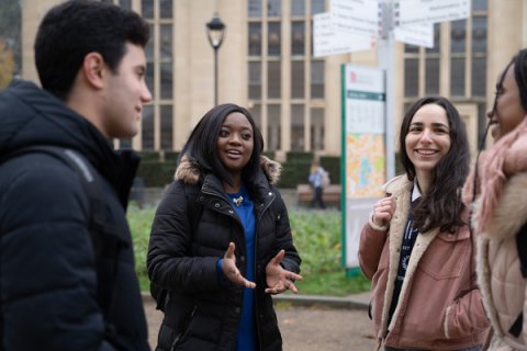 International students chatting on campus 