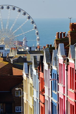Big wheel and colourful houses in East Sussex